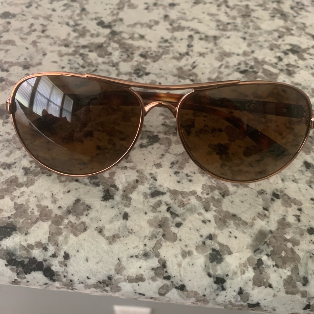 Rose gold Oakley Sun glasses